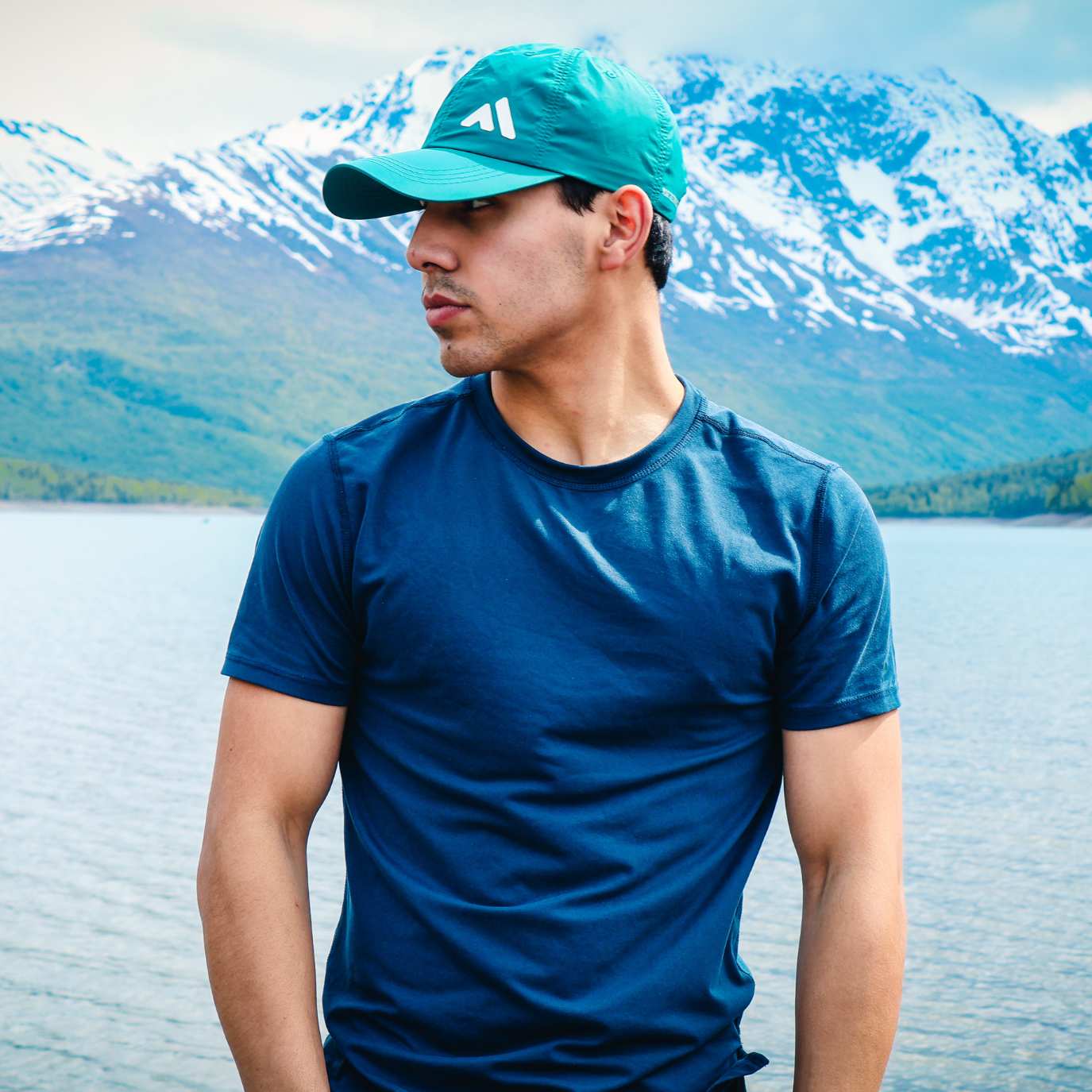 Man Wearing Turquoise Baseball Cap 