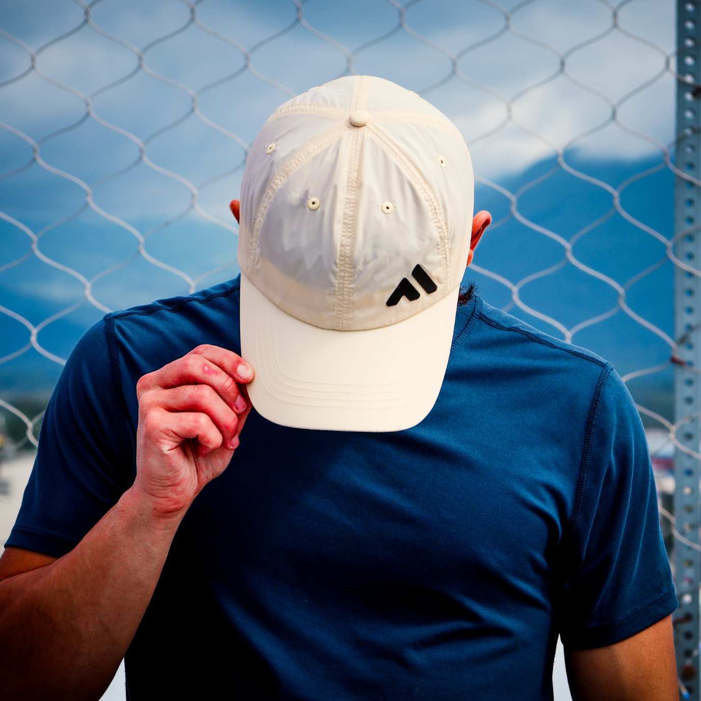 Man Wearing Tan Baseball Cap